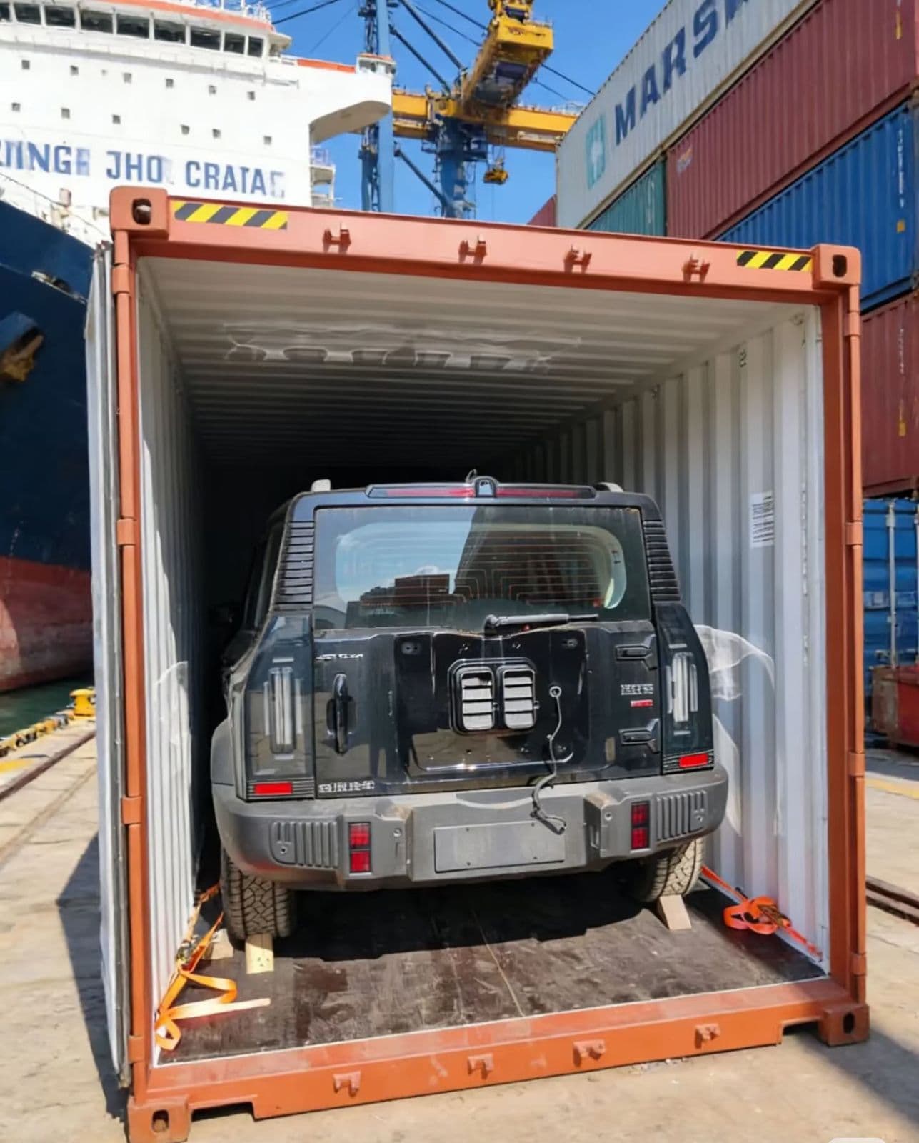 SUV secured inside a 40-foot container at port